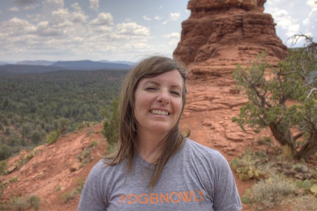 Smiling Woman Among Sedona's Red Rock Formations