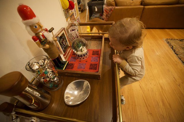 Toddler Discovering Christmas Decorations at Home