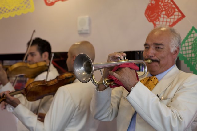 Trumpet Player in White Suit