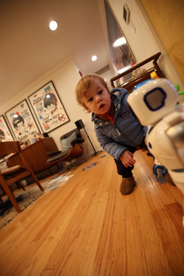 Toddler and Robot Toy in Modern Living Room