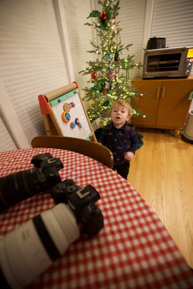Child's Candid Moment During Christmas Morning Photography Setup