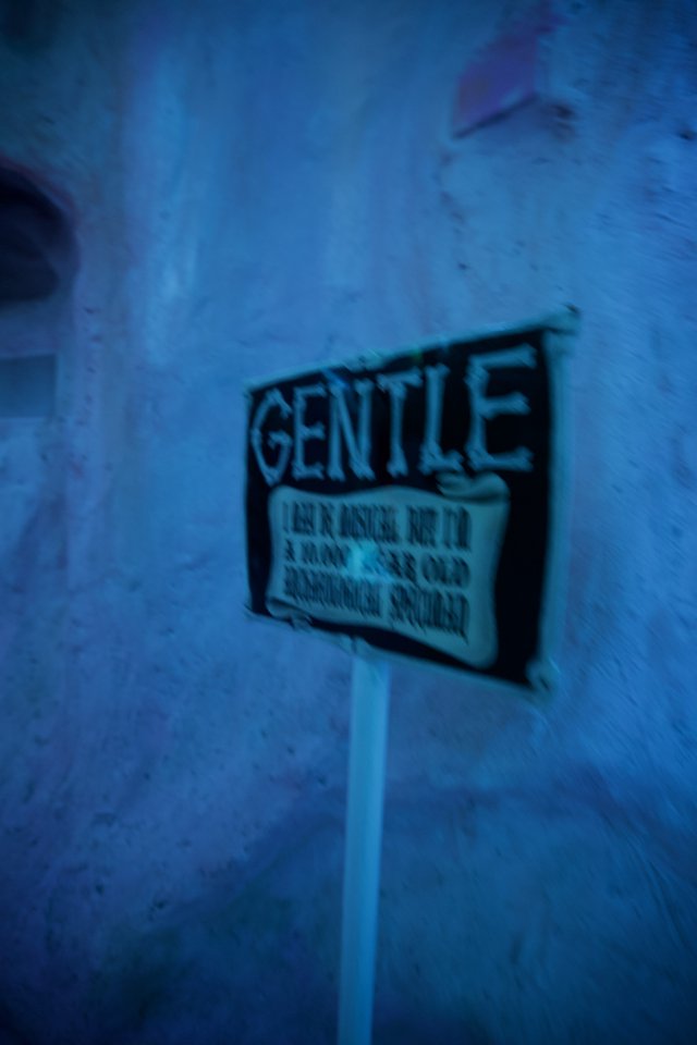 Vintage Gentle Sign in Blue-Tinted Atmospheric Scene