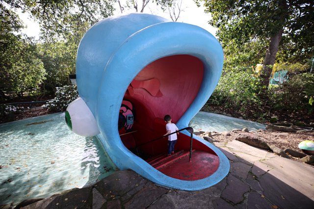 Child Exploring Giant Whale Mouth Playground Structure