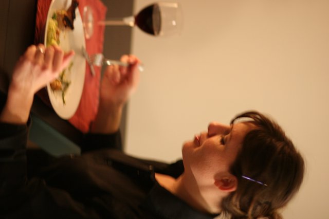 Quiet Dinner: Woman Dining Alone by Candlelight
