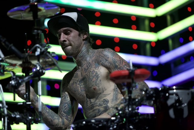 Travis Barker Rocks the Drums with His Tattoos on Display