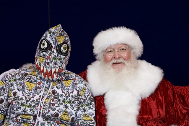 Santa meets his masked match