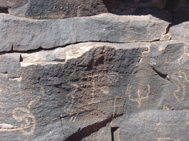 Ancient Petroglyphs on Slate Rock Wall