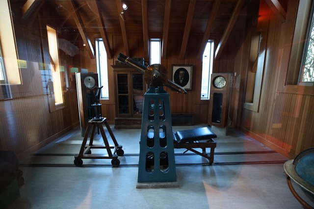 Historic Observatory Interior with Vintage Telescope