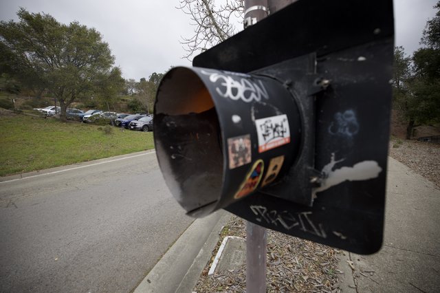 Graffiti-Tagged Black Mailbox in Suburban Setting