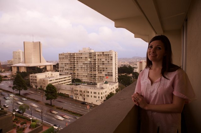 Woman Gazes Over San Francisco City Skyline at Dusk