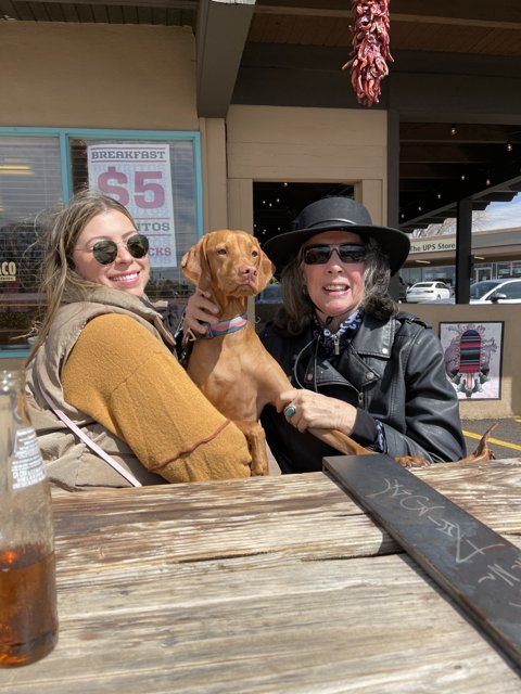 Two Women and a Four-Legged Friend Enjoying the Santa Fe Sunshine