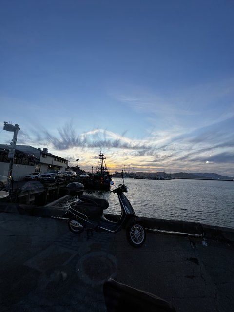 Sunset Scooter by the Dock