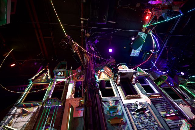 Neon-Lit Chaotic Installation with Vintage Frames and LED Lights