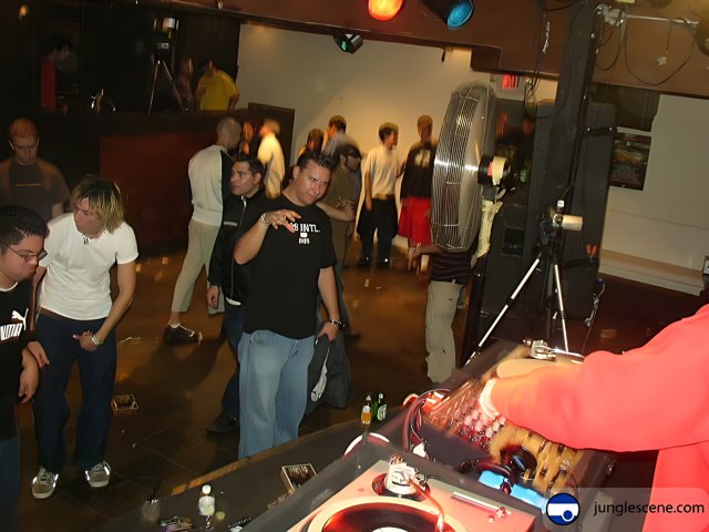 Red Shirt DJ at Night Club