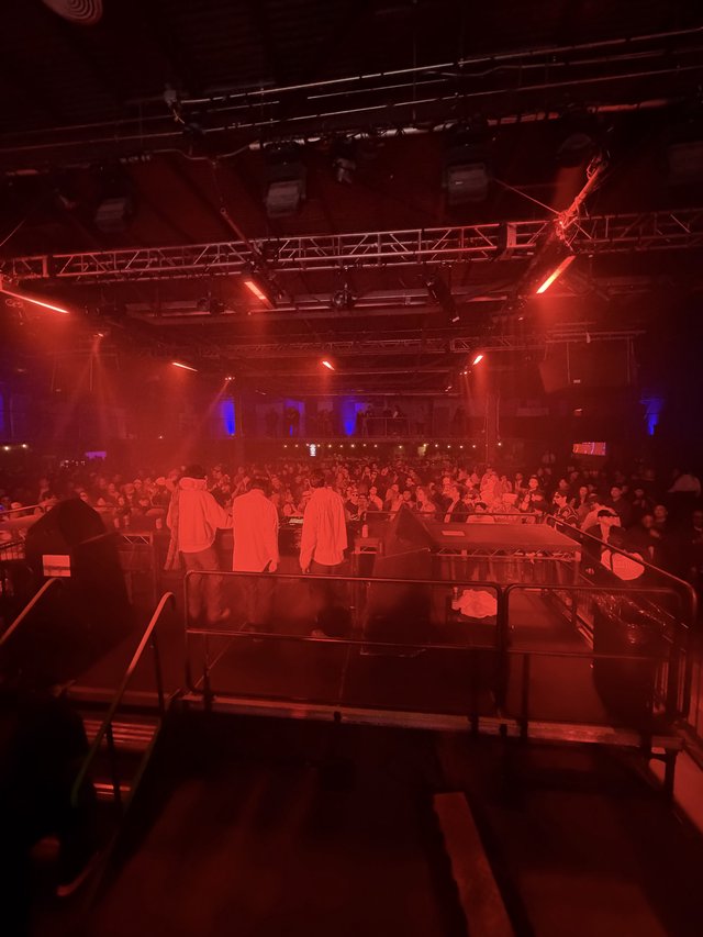 Red-Lit Electronic Music Venue Before Performance