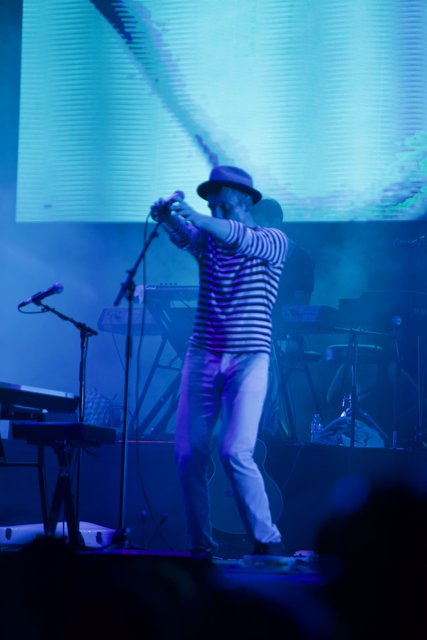 On Stage with a Striped Shirt and Hat