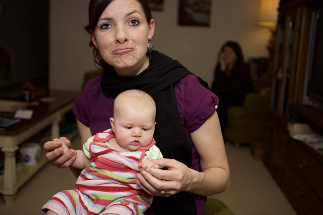 Mother and Baby Share Matching Exasperated Expressions