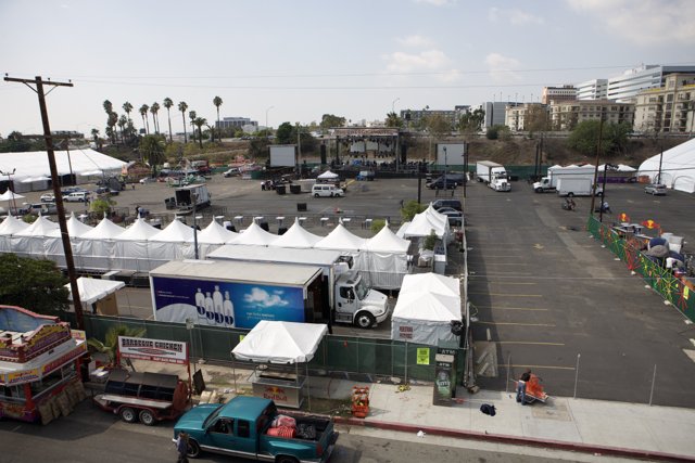 Trucks and Tents in a Busy Parking Lot