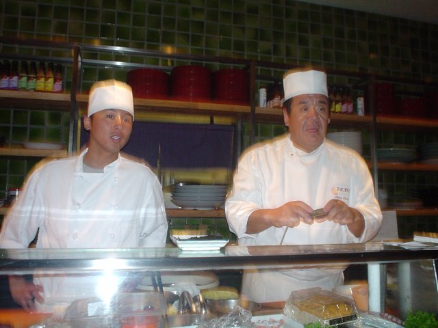 Two Chefs in Deli Shop Uniforms