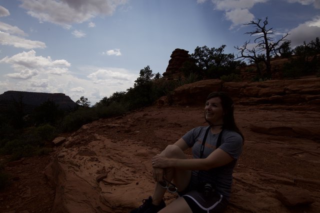Hiker Resting on Red Rock Formations in Sedona
