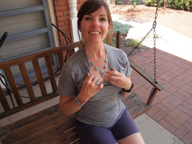 Woman Showing Off Turquoise Jewelry on Porch Swing