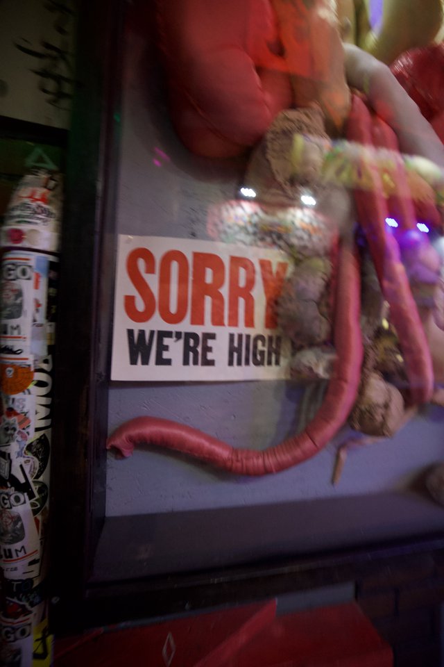 Humorous 'Sorry We're High' Sign with Inflatable Display