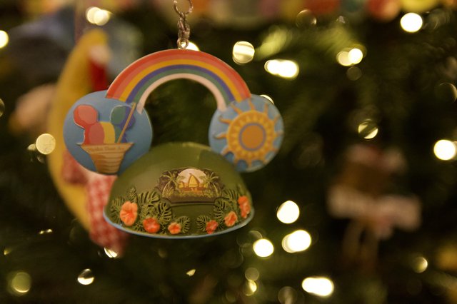 Whimsical Rainbow Christmas Ornament with Bokeh Lights