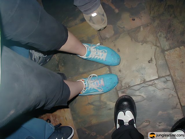 Blue Sneakers on the Ground