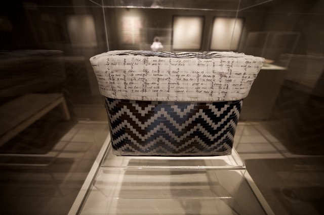 Traditional Woven Basket with Chevron Pattern in Museum Display