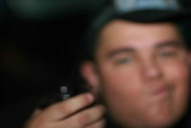 Blurry Man with Cell Phone