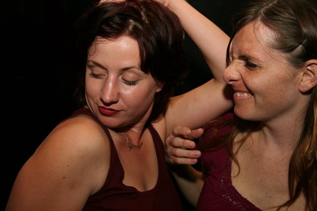 Two Women Dancing Together at Nightclub Party