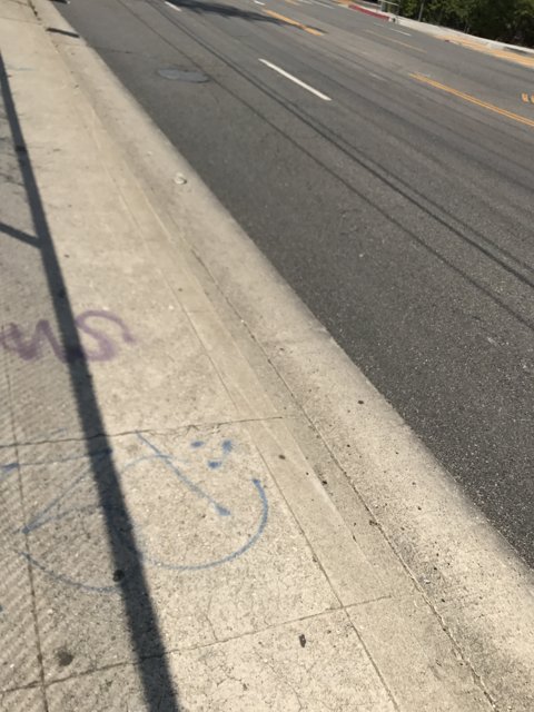 Graffiti and a Car on the Sidewalk