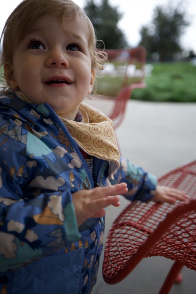 Joyful Toddler at Outdoor Playground on Winter Day