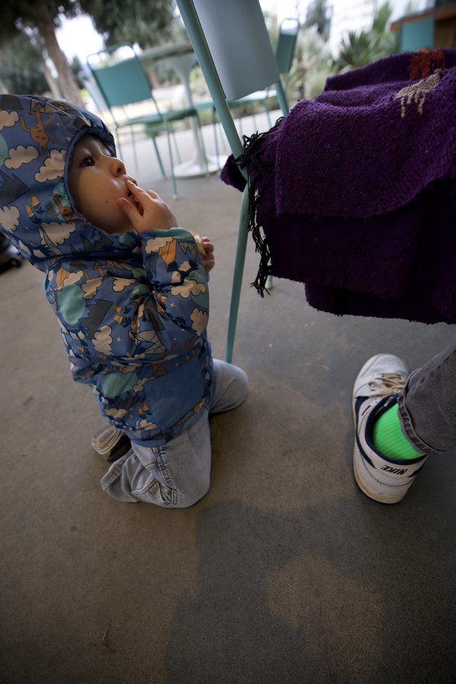 Toddler in Cloud-Print Jacket at Playground
