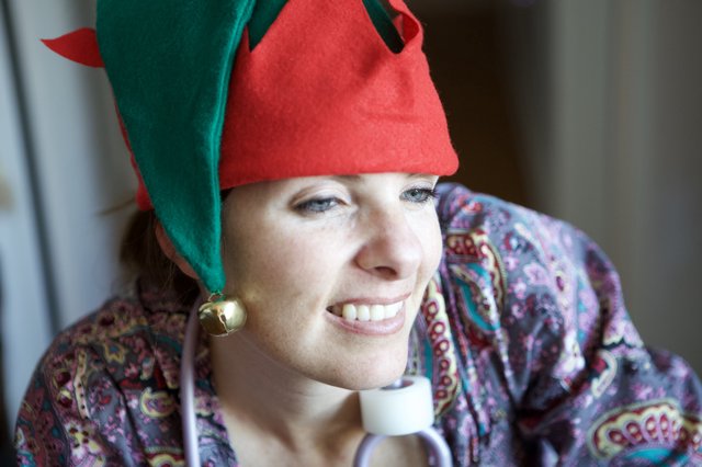 Joyful Woman in Christmas Elf Hat Smiling Warmly