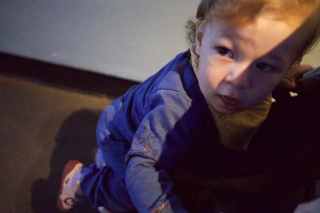 Curious Toddler in Blue Pajamas Close-Up Portrait