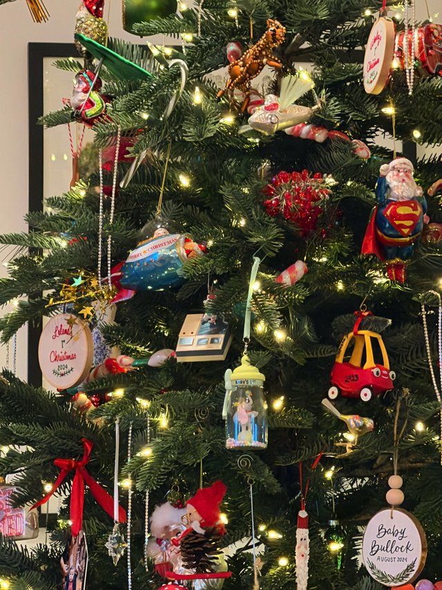 Eclectic Christmas Tree Filled with Personal Ornaments and Memories