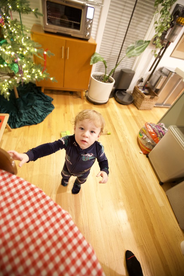 Toddler Reaching Out on Christmas Morning