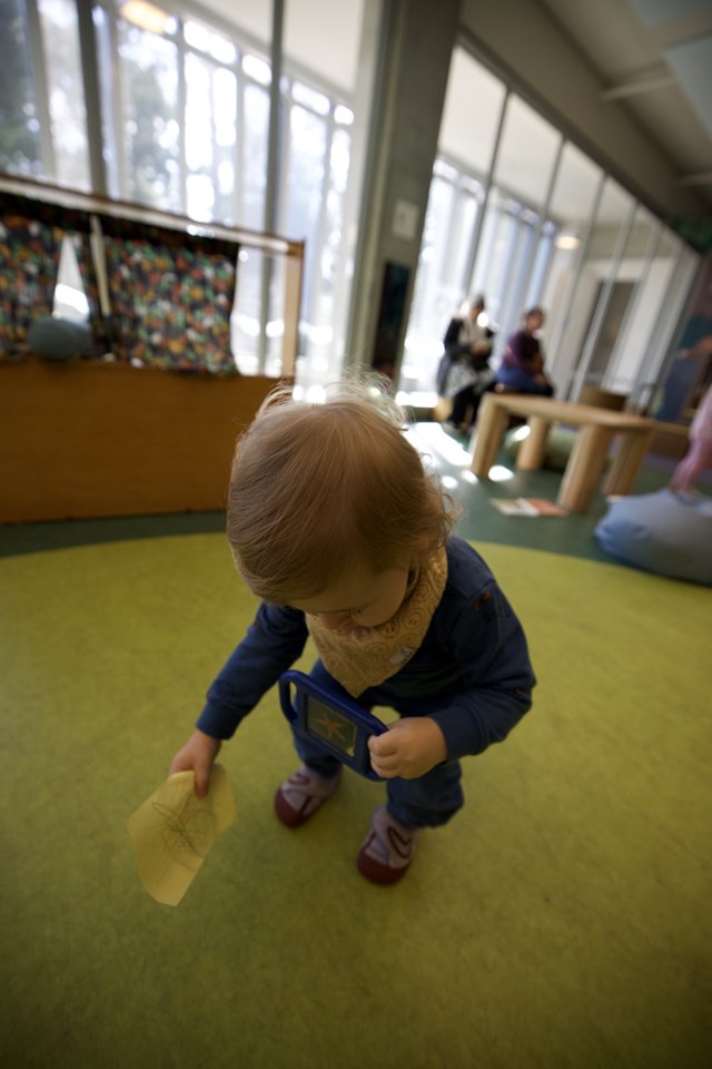 Toddler Exploring Play Space in Bright Indoor Environment