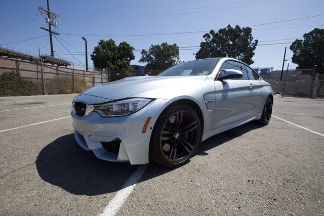 Sleek BMW M4 Coupe in Parking Lot