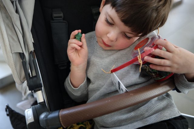 Child with Gummy Candy Container on Airplane