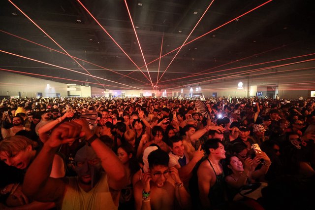 Red Laser Light Show Over Massive EDM Festival Crowd