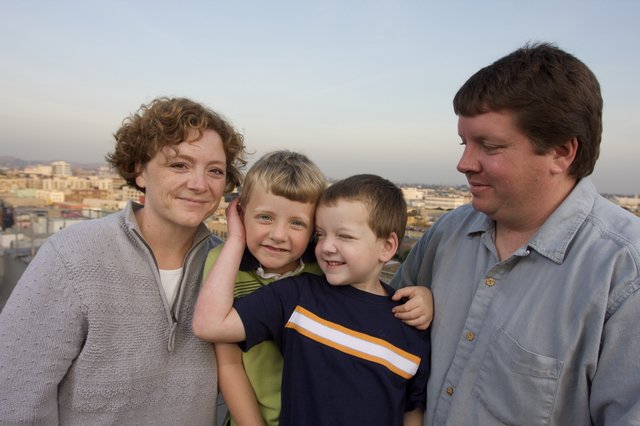 Family Portrait on City Rooftop at Dusk