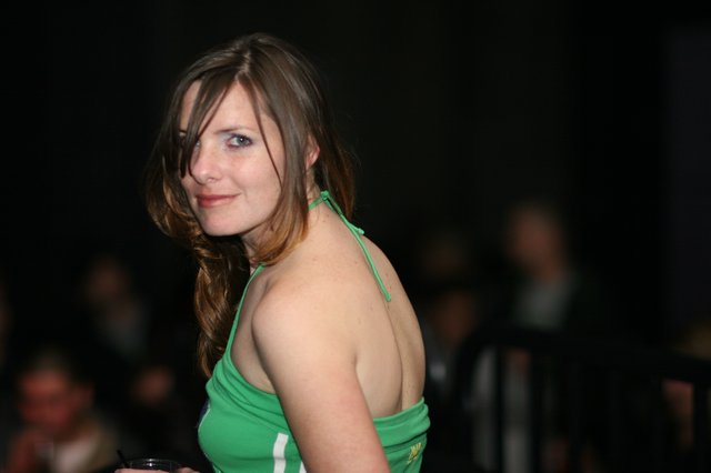 Woman in Green Halter Top at Evening Event