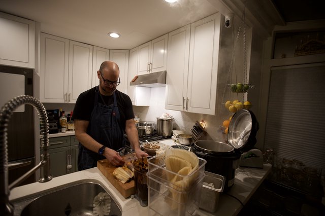 Home Chef Preparing Christmas Eve Dinner in Modern Kitchen