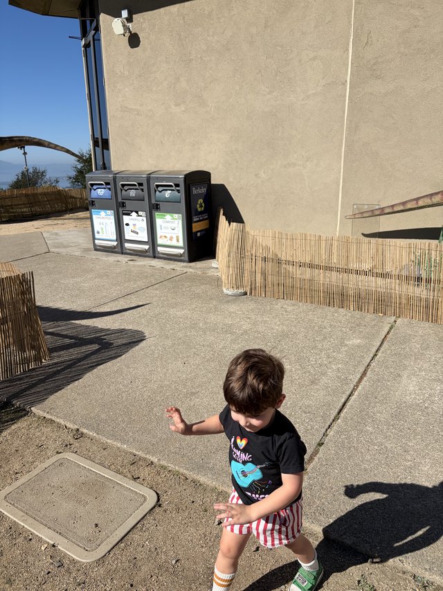 Young Child Running on Seaside Promenade