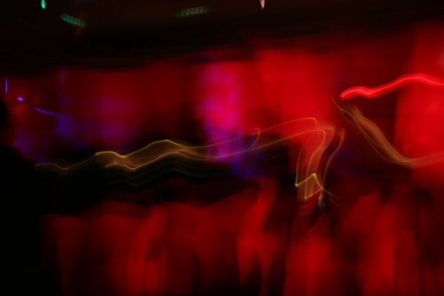 Blurred Nightclub Lights and Dancing Figures