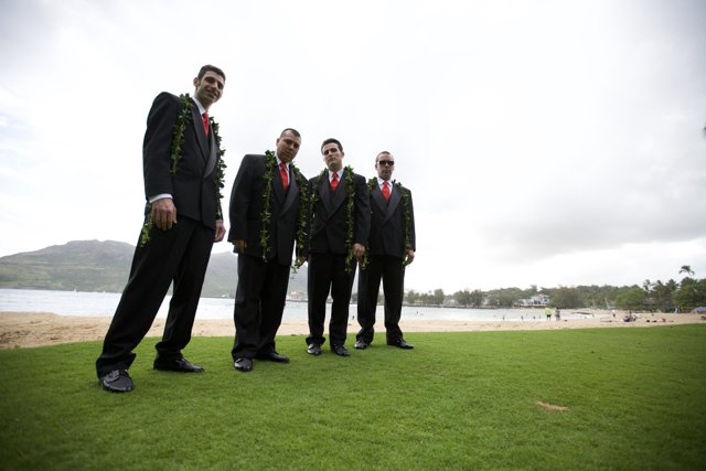 Four Groomsmen Posing on the Green Lawns