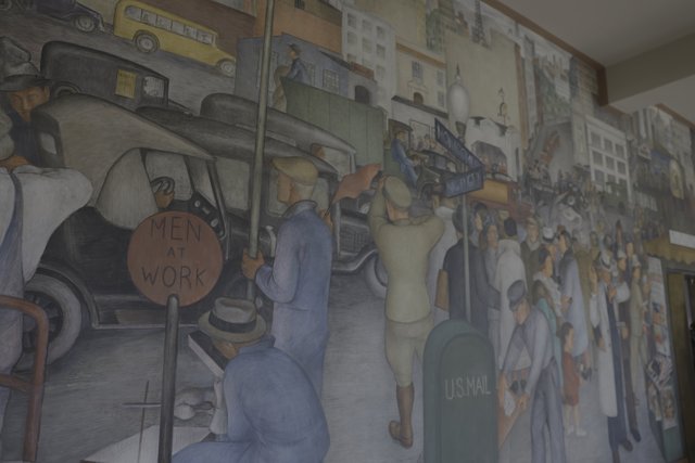 Colorful Mural of People and Cars in a Modern Building