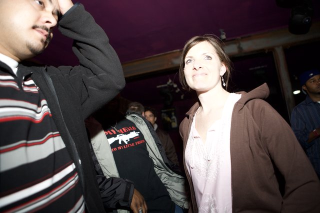 Nightclub Crowd Scene with Woman Looking Up